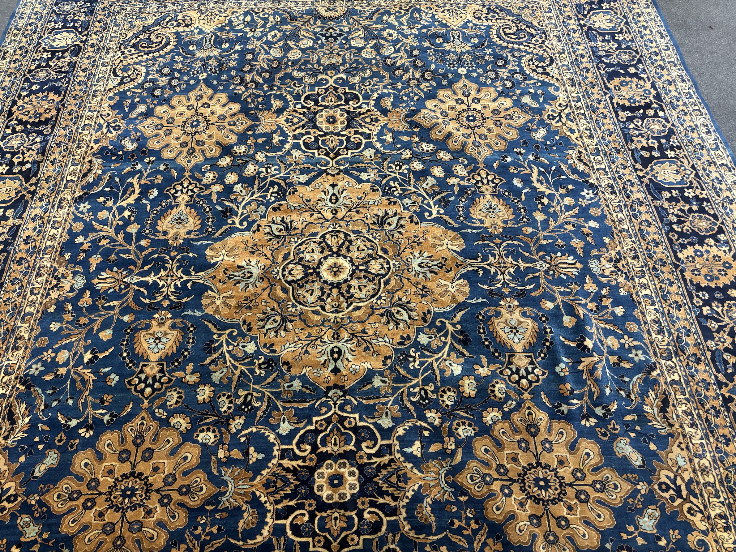 An early 20th century Kirman blue ground carpet, 425 x 325cm